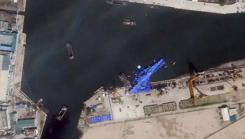 Warship Falls from Its Cradle Under Kim's Watchful Gaze: Satellite Images Reveal Damage